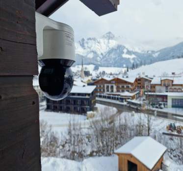 A cctv camera overlooking the Astrian mountains covered in snow